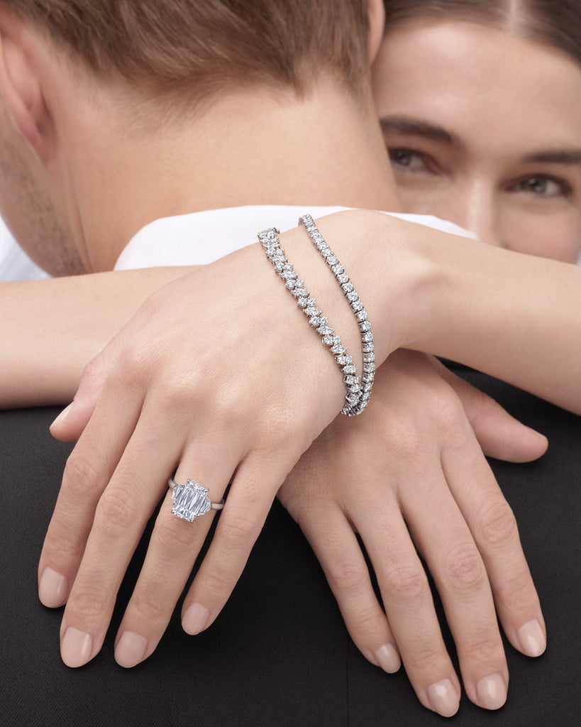 Couple Embracing While Wearing Diamond Ring and Bangles